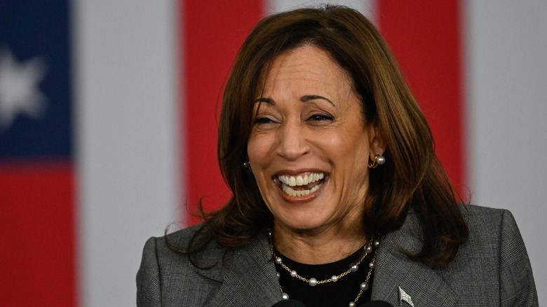 Kamala Harris laughing while attending a rally