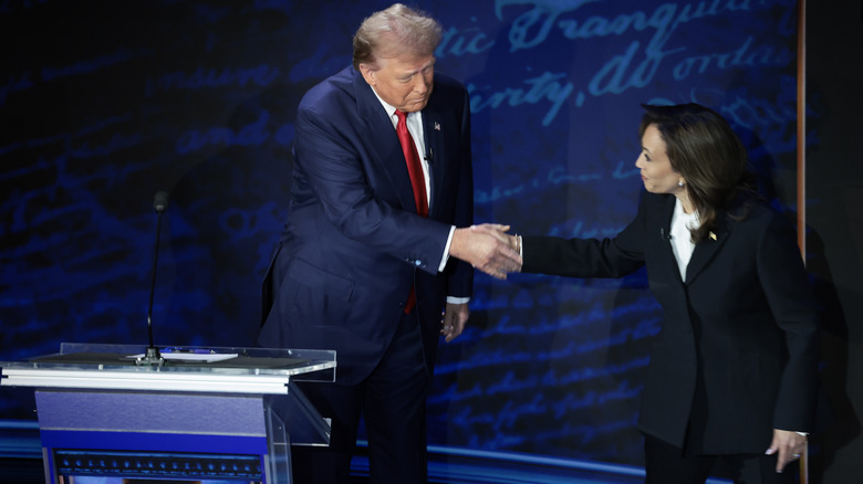 Donald Trump and Kamala Harris shaking hands