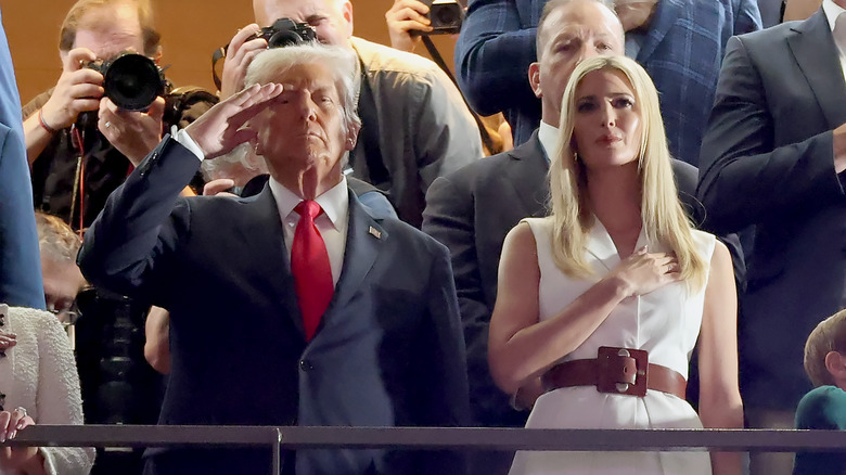 Donald and Ivanka Trump saluting flag at Super Bowl LXI