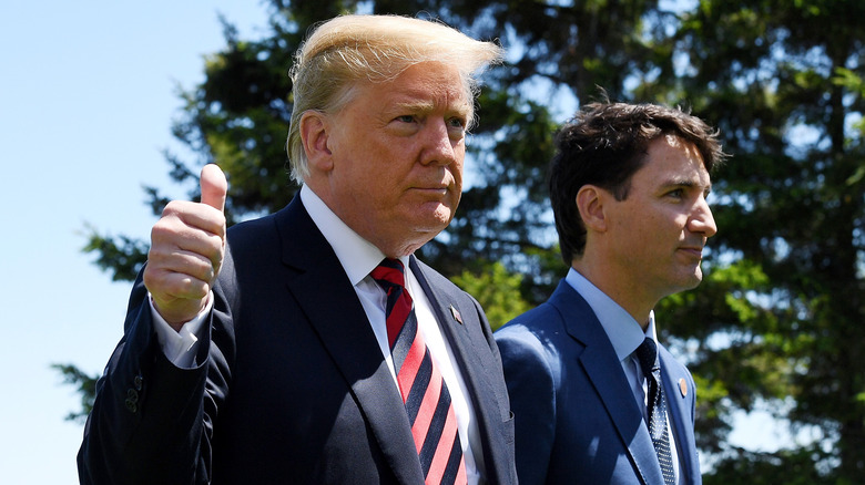 Justin Trudeau and Donald Trump walking in suits