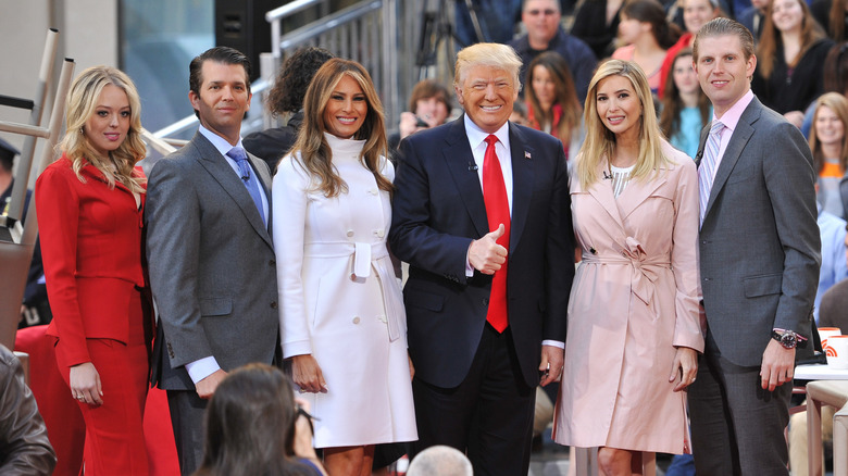 Tiffany, Don Jr., Melania, Donald, Ivanka, and Eric Trump posing