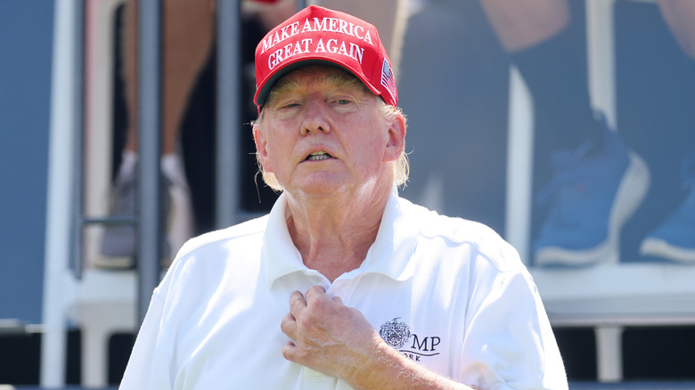 Donald Trump looking introspective while playing golf