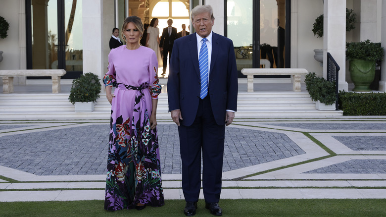 Donald Trump and Melania purple pantsuit