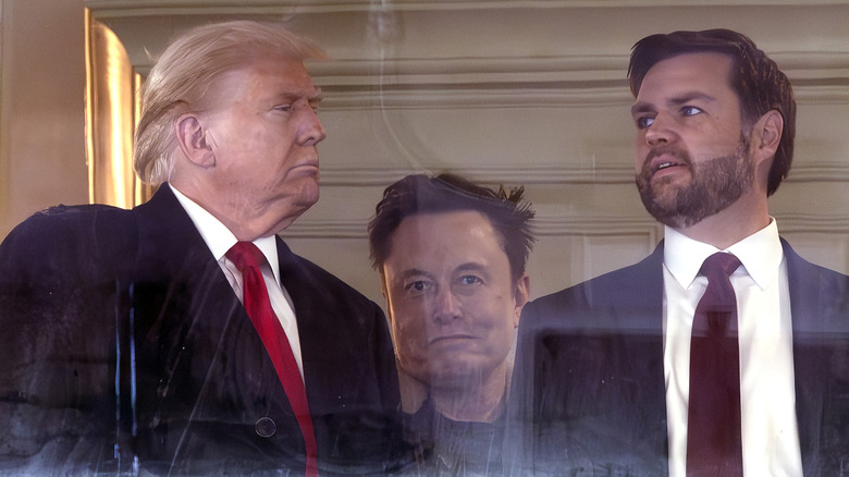 Elon musk standing behind Donald Trump and JD Vance