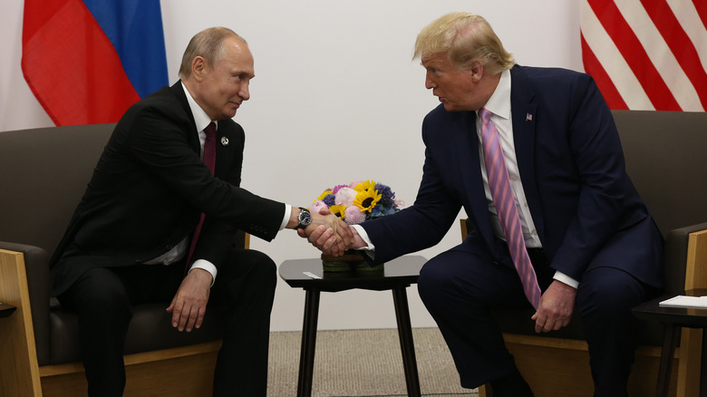 Vladimir Putin and Donald Trump shaking hands