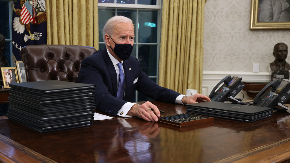 Biden at the Resolute Desk on his first day