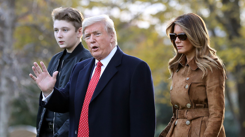 Barron Trump, Donald Trump, and Melania Trump walking