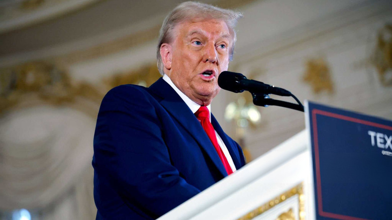 Donald Trump speaking at podium at Mar-a-Lago