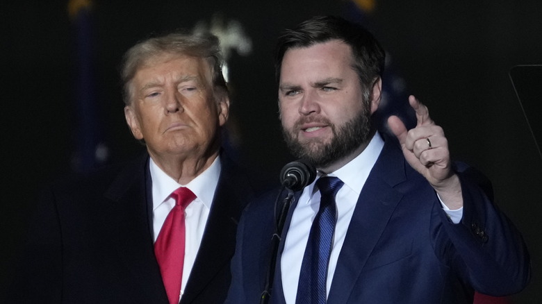 Donald Trump standing by J.D. Vance