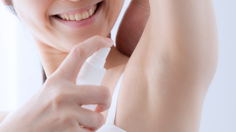 Woman spraying homemade deodorant