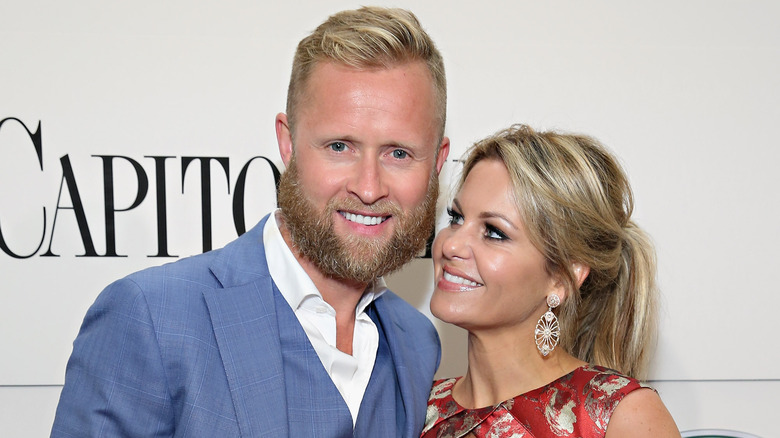 TV host Candace Cameron Bure and her husband at an event 