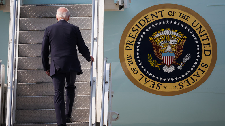 Joe Biden ascends stairs to Air Force One