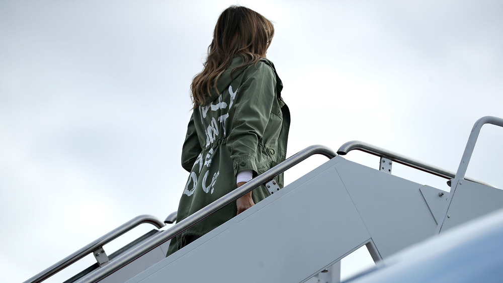 Melania wearing her "I don't care do you" coat