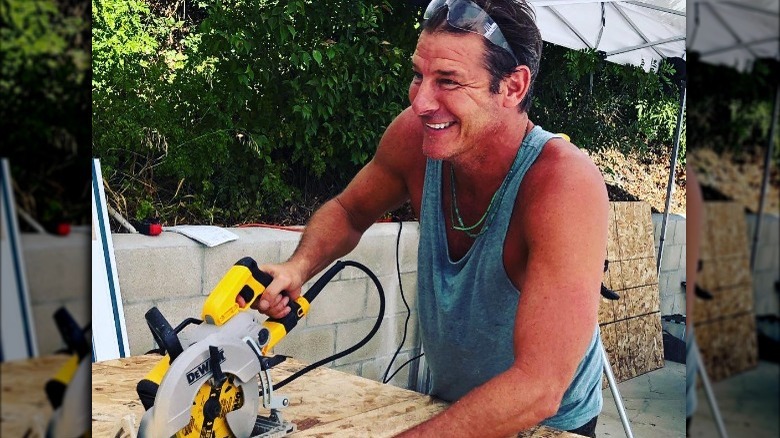 Ty Pennington using saw