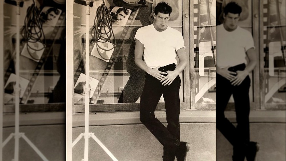 Ty Pennington throwback modeling photo in white t shirt and spikey hair