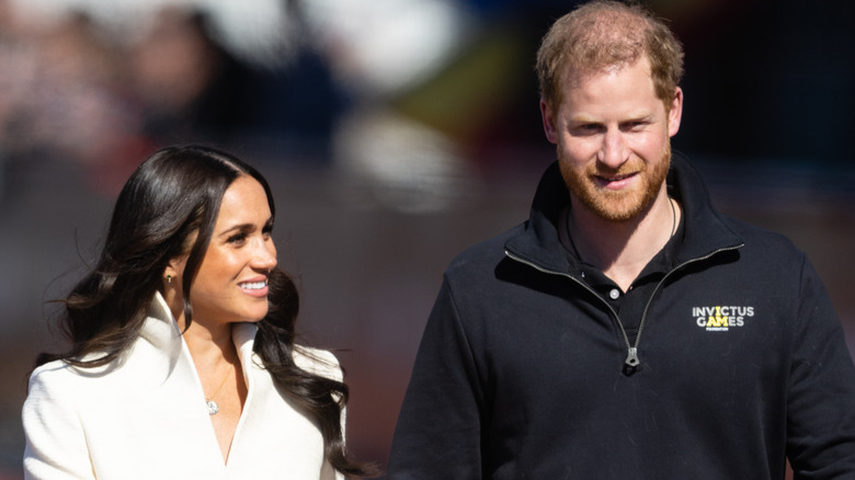 Harry and Meghan walk side by side