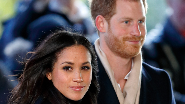 Meghan Markle and Prince Harry walking to an event