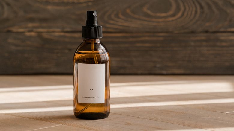 essential oil bottle on wooden surface