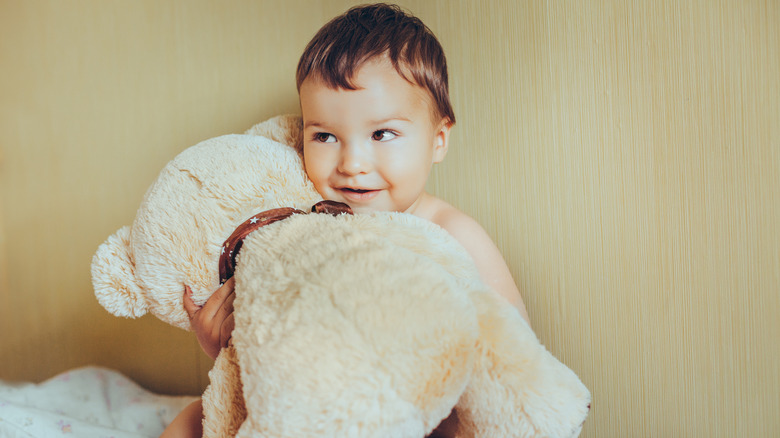 Baby holding a teddy bear