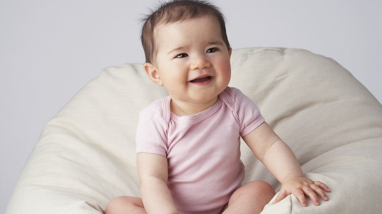 Baby in pink onesie