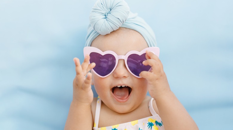 Baby in heart-shaped sunglasses