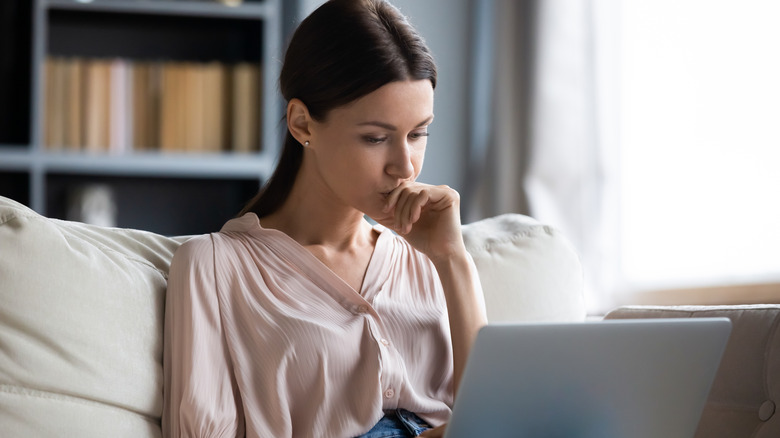 woman looking at the laptop