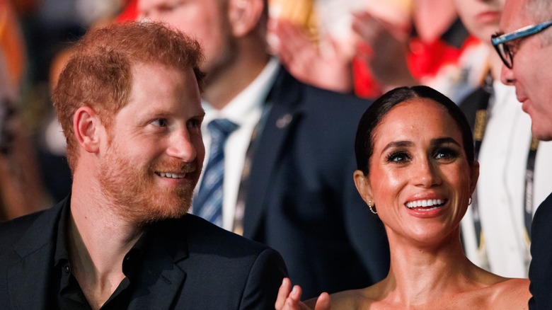 Prince Harry and Meghan Markle smiling