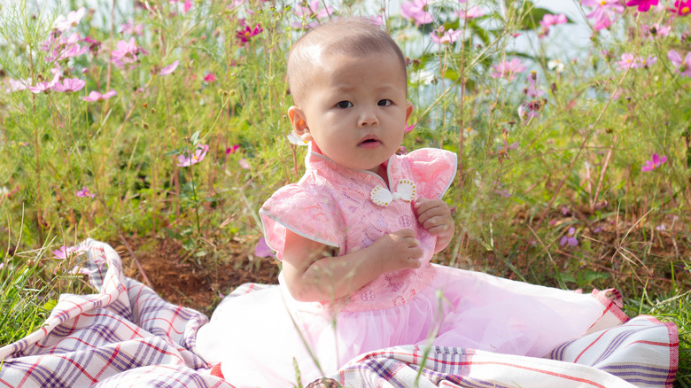 Baby in flower field