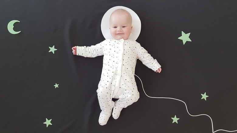 Baby posing as astronaut