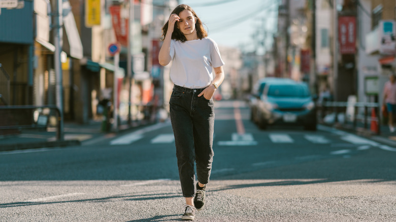 woman walking in jeans and tshirt