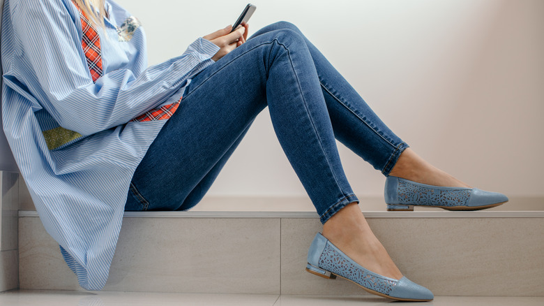 woman sitting on stairs