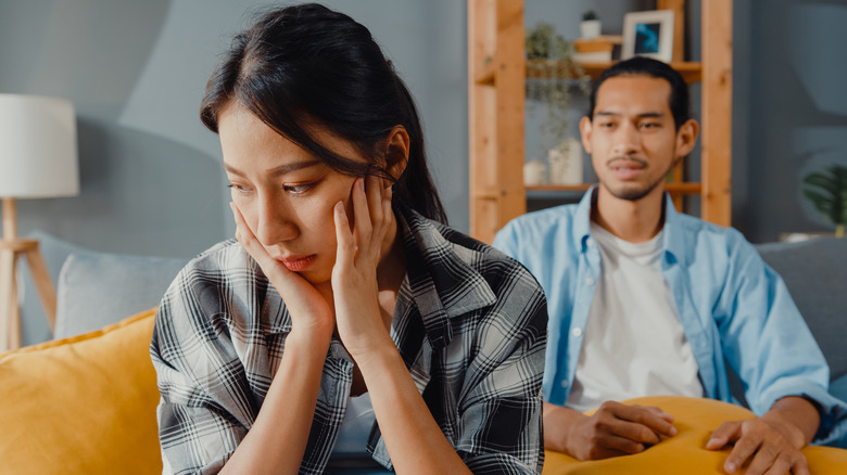 Man looking at his sad wife