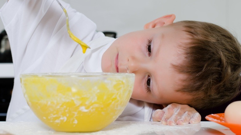 child baking cake