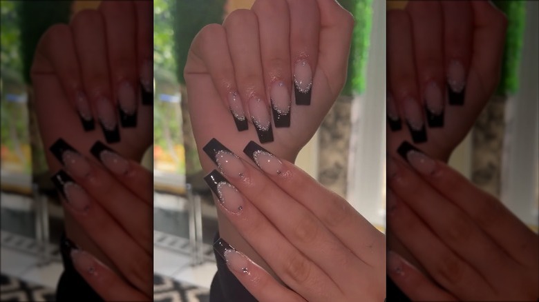 closeup black tipped nails