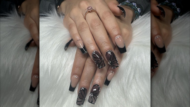 Black tips and butterfly wing nail design