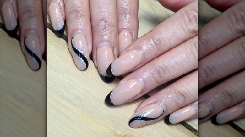 Black tips with swirls of silver