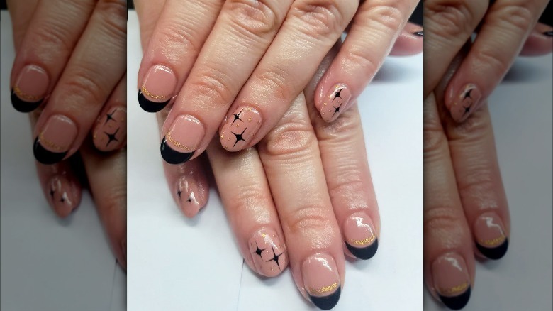 Black tips with gold bands and stars