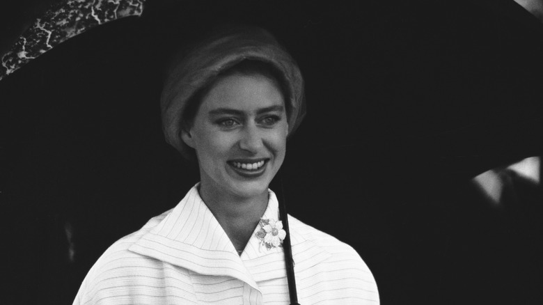 Princess Margaret holds umbrella 1958