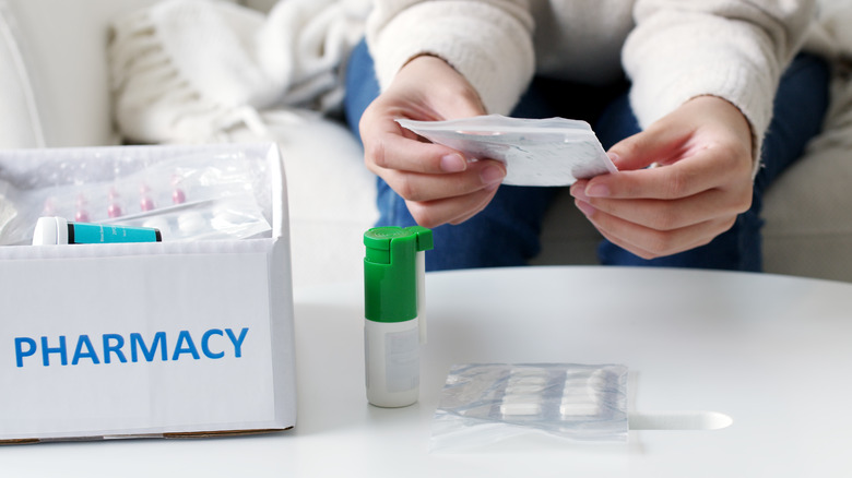 person with shipment of medication from pharmacy 