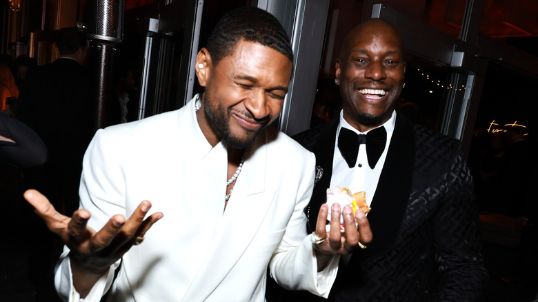 Usher and Tyrese Gibson attending a party