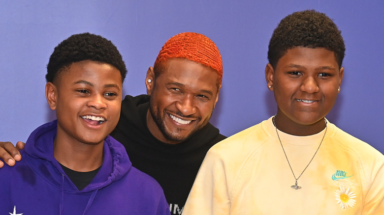 Usher and sons, smiling