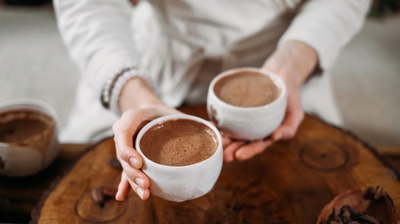 woman holding hot cocoa