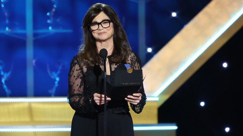 Valerie Bertinelli wearing glasses and presenting an award