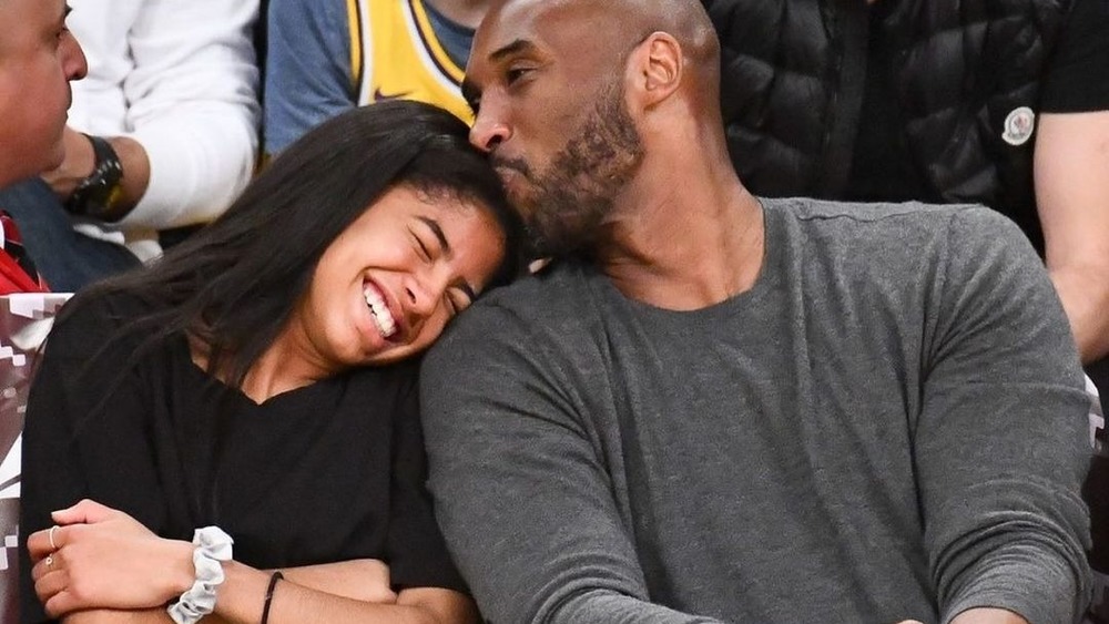 Kobe Bryant kissing Gianna