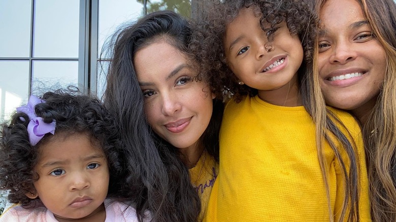 Vanessa Bryant and Ciara without makeup posing with her children