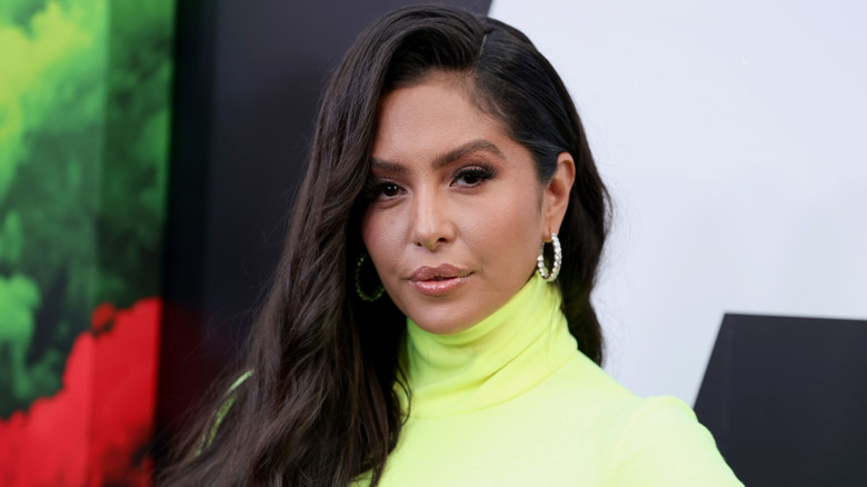 Vanessa Bryant posing in yellow turtleneck