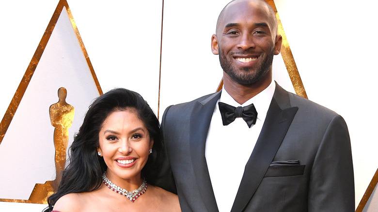 Kobe and Vanessa Bryant posing on Oscars red carpet