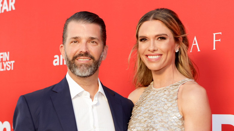 Donald Trump Jr. poses at an event with Bettina Anderson