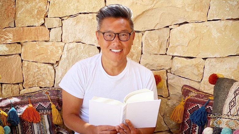 Vern Yip with a book