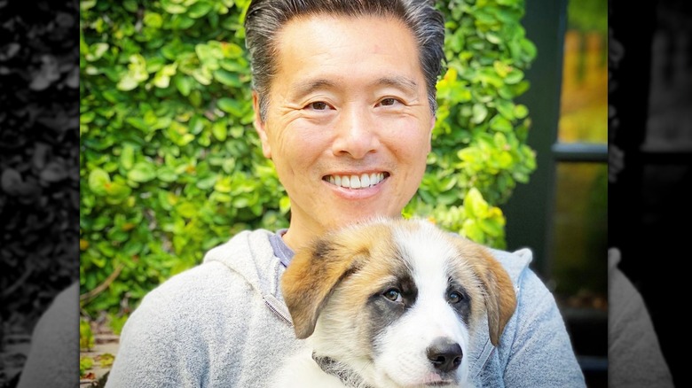 Vern Yip outdoors with small dog